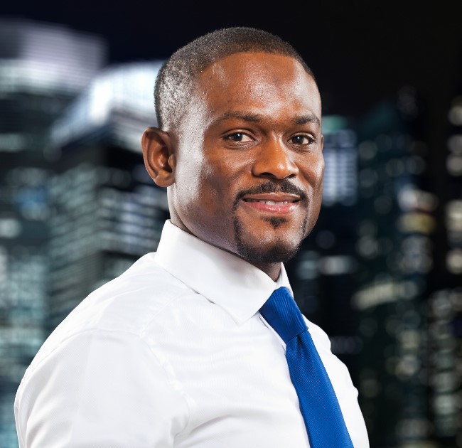 A certified technician from Kishindo Solutions carefully installing a security system.