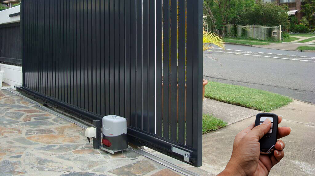 A sleek, modern automated gate system for a residential driveway.
